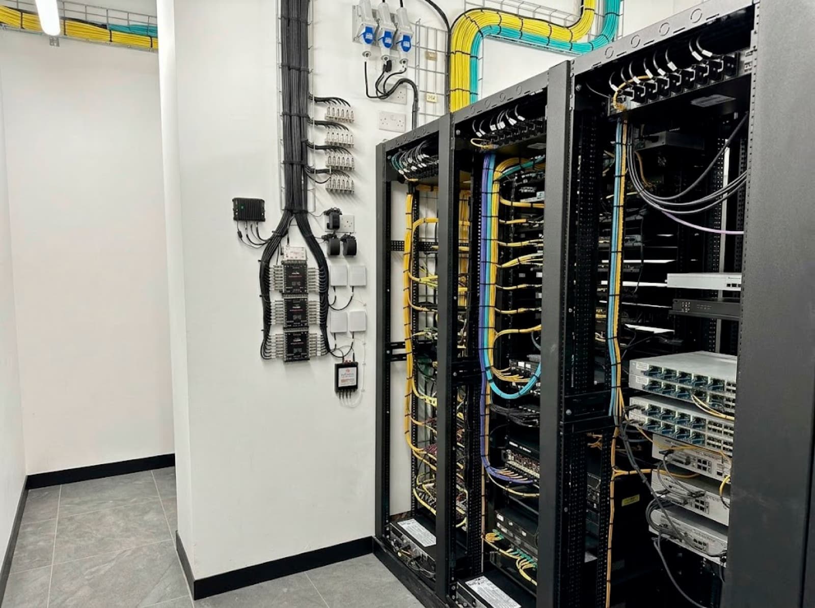 Finished MDF rack and structured cable management at an industrial distribution facility